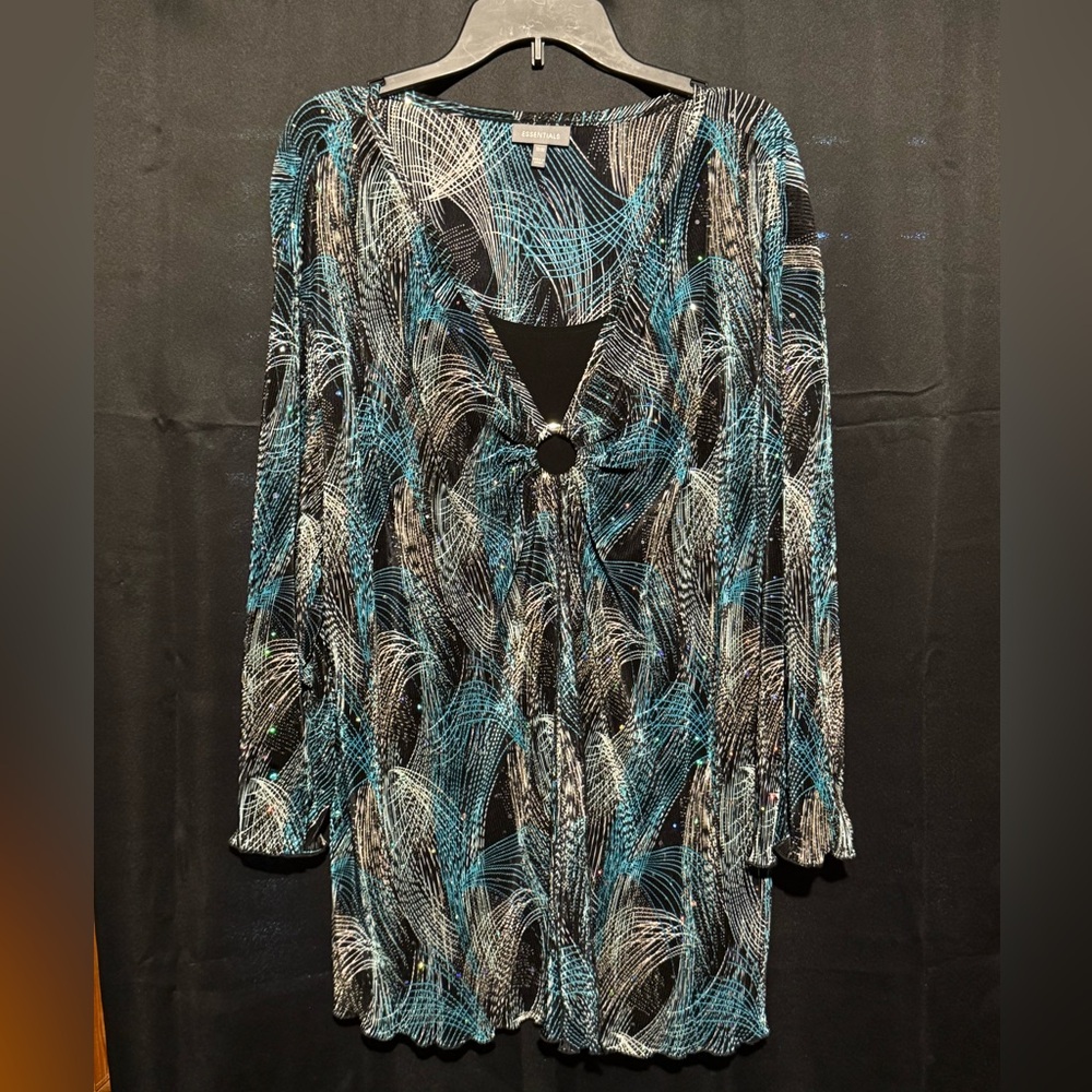 ESSENTIALS Blue, black, and white sparkly woman’s top